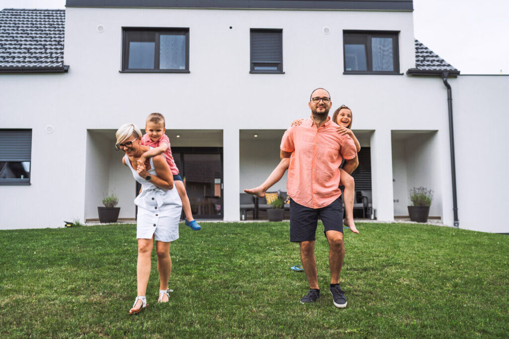 rsz_young-family-standing-outside-their-house-each-of-2025-01-29-02-09-19-utc (1)